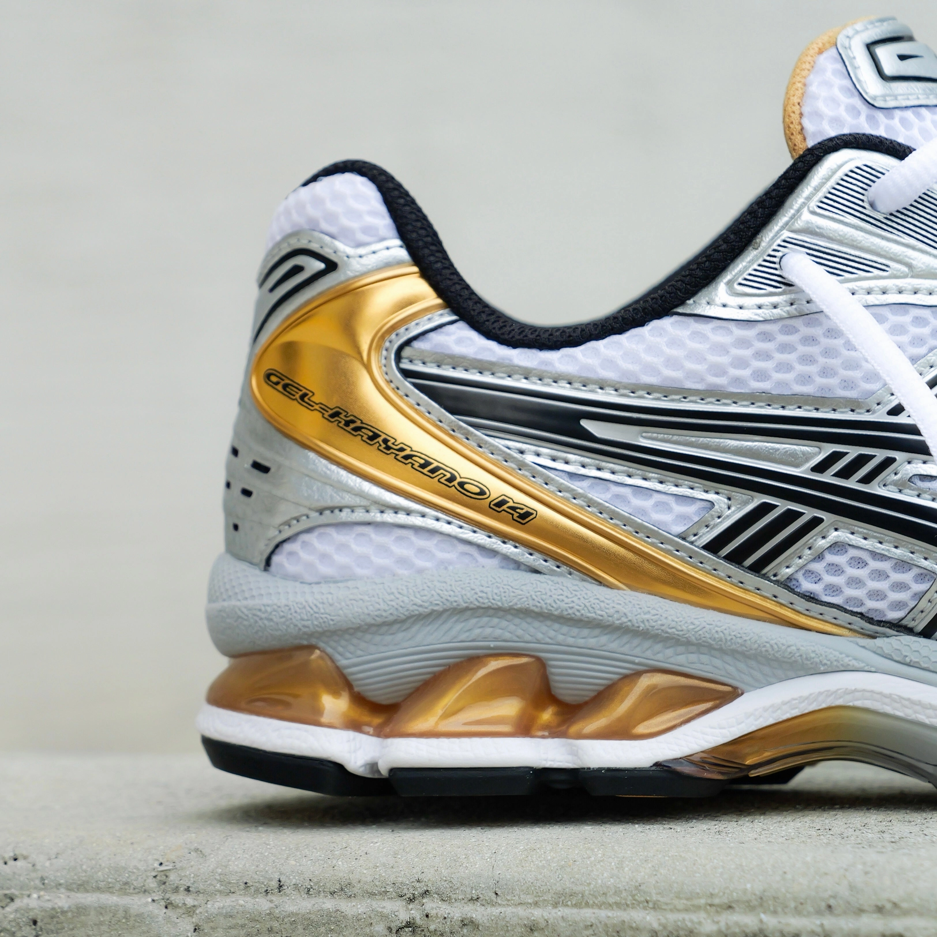 Mens Asics Gel-Kayano 14 (White/Pure Gold) running shoe close-up shots